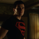 Superboy, looking pretty calm while taking gunfire to the chest.